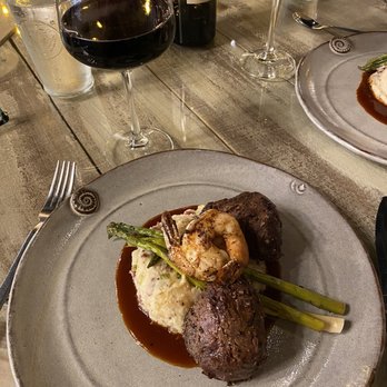 Dumbwaiter Restaurant signature dishes Sweet Tea Brined Double Cut Pork ChopDumbwaiter Green Tomato StackPan Seared Scallops with Crisp Apple Salad